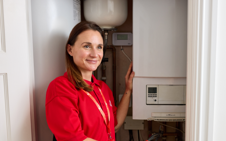 A HomeServe heating engineer completing a boiler service